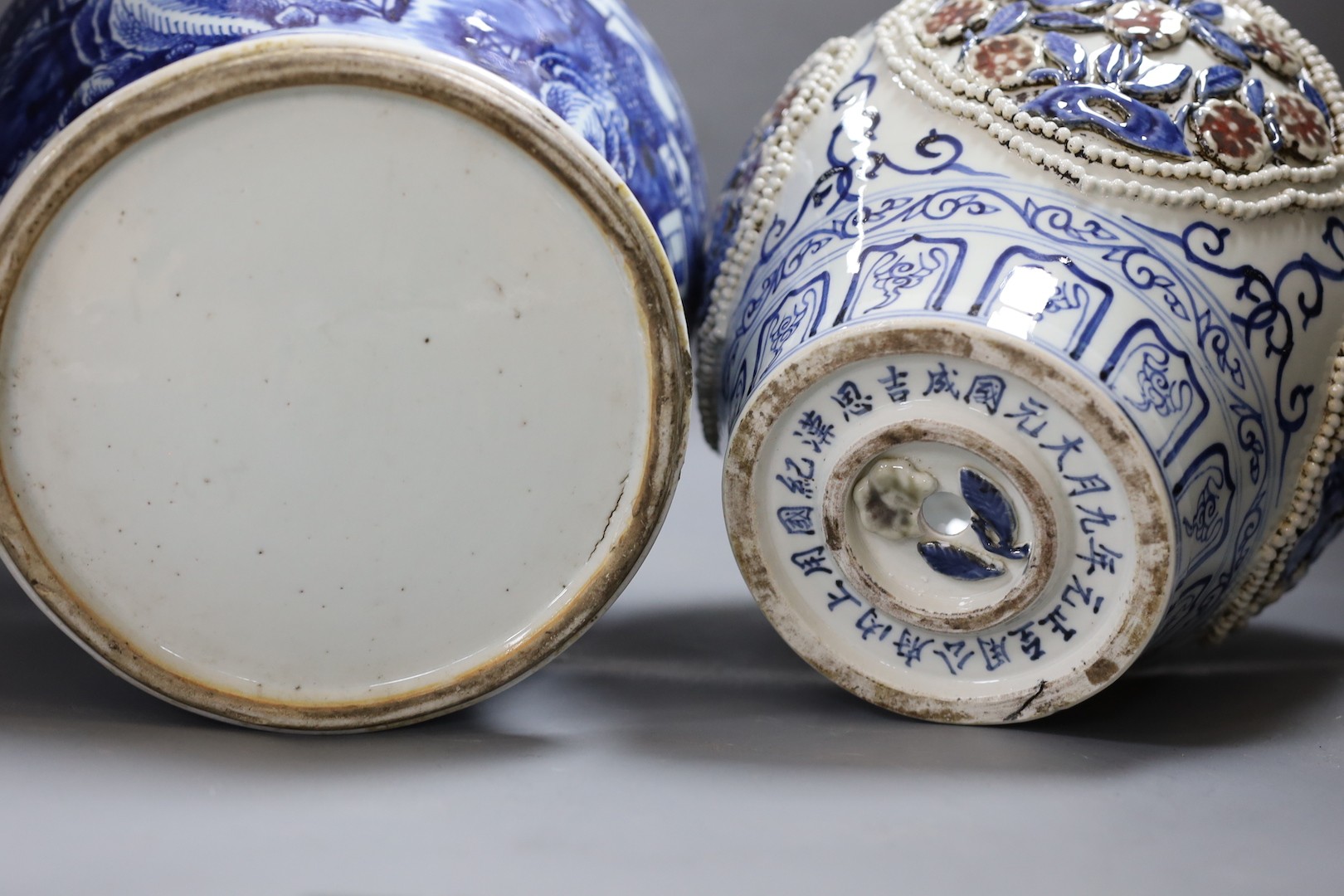 A large Chinese blue and white jar and cover and a blue and white jar and cover, 19th-century and later. Largest 44cm